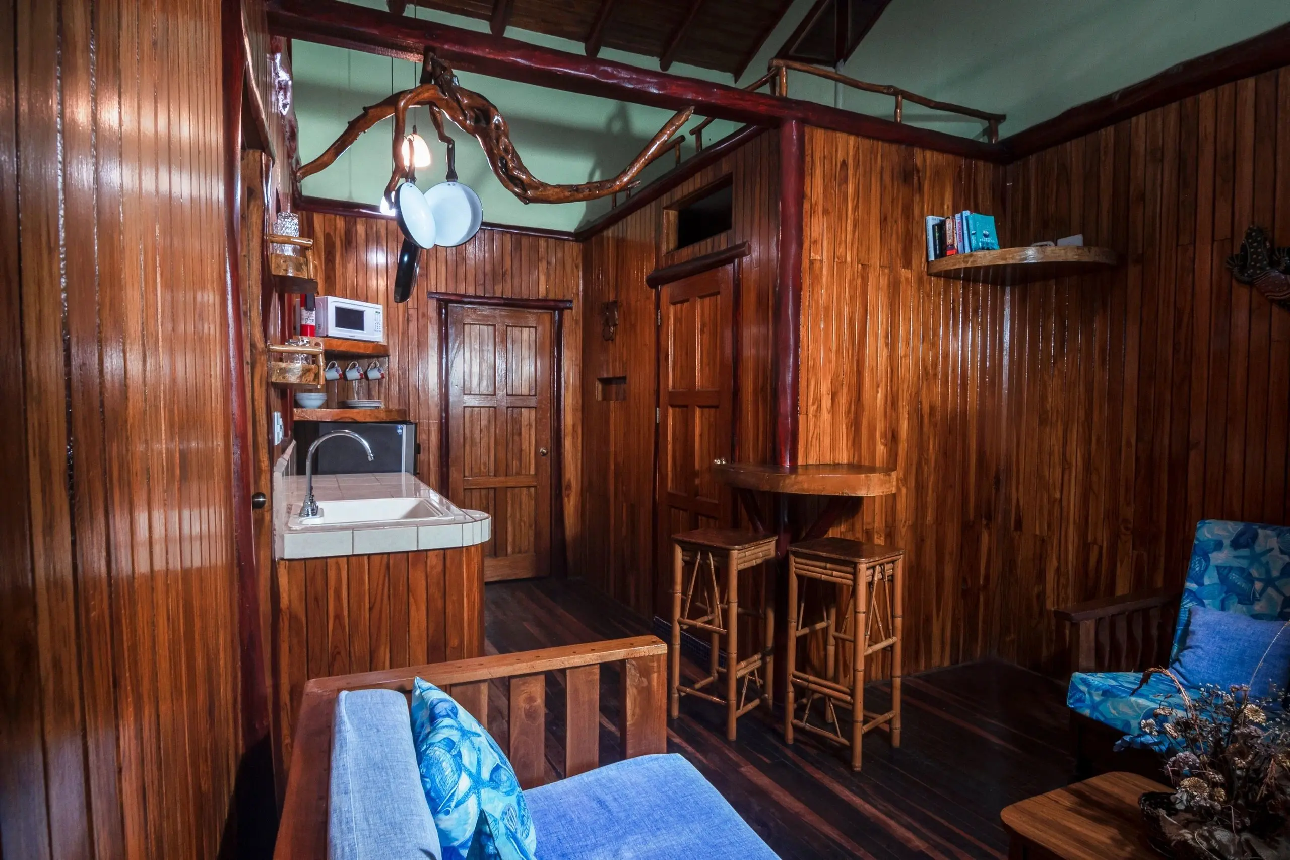 A room with wooden walls and furniture.