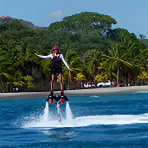 A man is water skiing on the ocean.